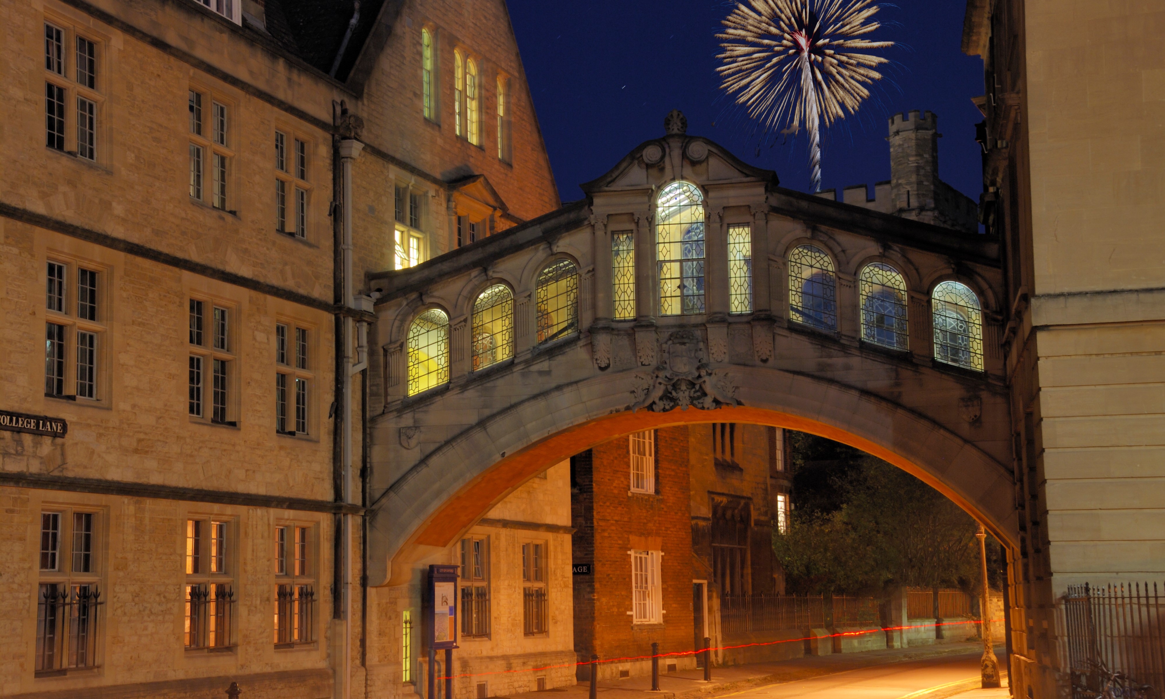 Fireworks light up the sky above the Bridge of Sighs on College Lane in Oxford