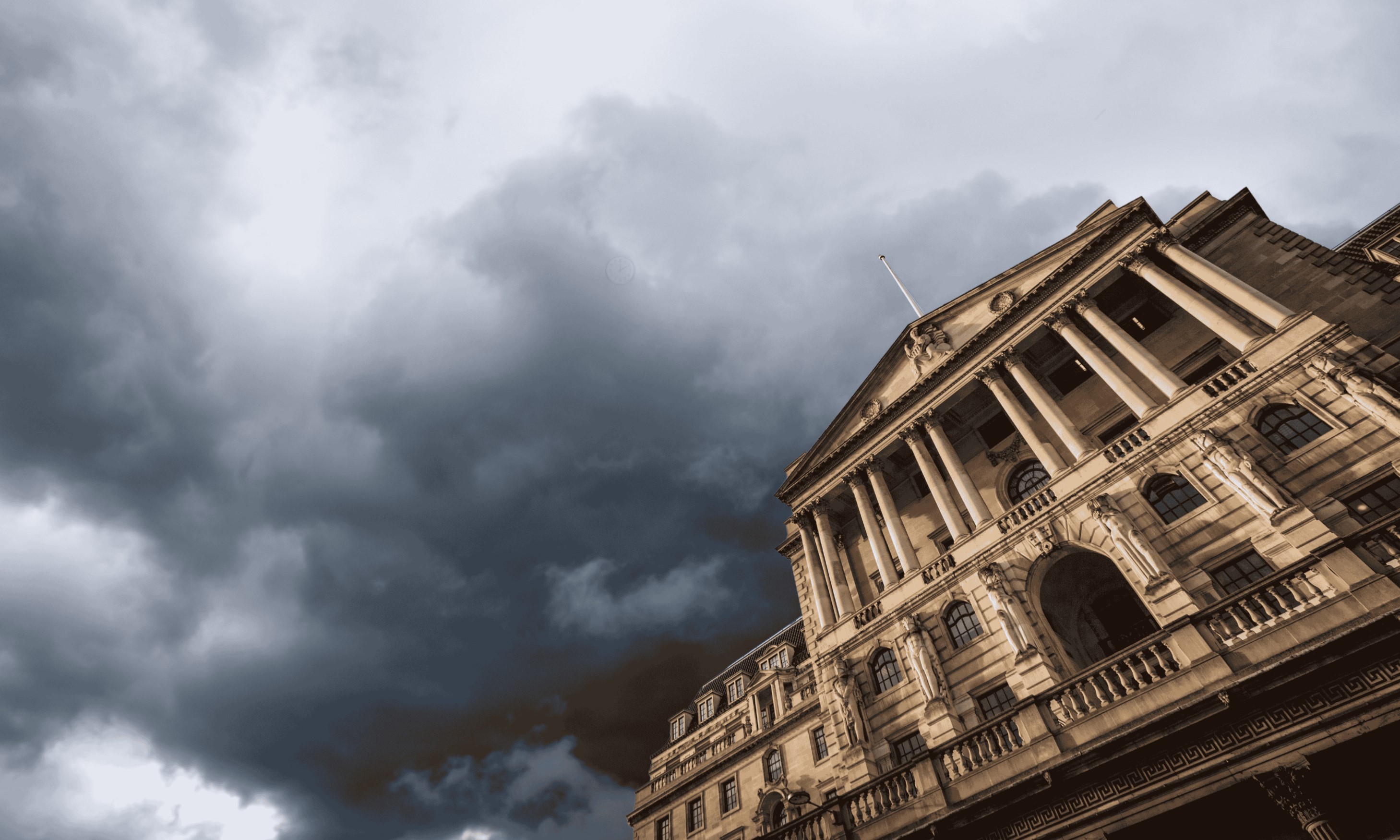 Storm clouds over the economy - but is the property market affected? Bank of England beneath a grey stormy sky